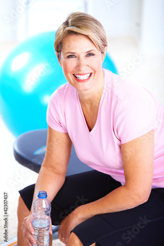 Photo: Senior woman doing yoga. Senior woman doing yoga.