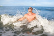 Happy muscular male enjoying the sea