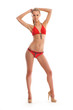 A young Caucasian woman posing in a red swimsuit