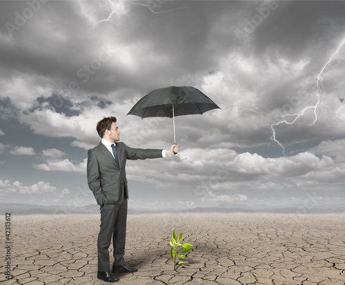 Foto: Businessman helps agriculture Businessman helps agriculture