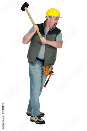 Foto: Man with hammer hitting Man with hammer hitting