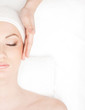 Photo: Portrait of a young woman laying on a spa procedure Portrait of a young woman laying on a spa procedure