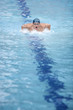 dynamic professional swimmer, swimming in swimming pool