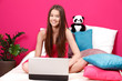 Photo: teenager smiling and using laptop teenager smiling and using laptop