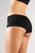 Slim tanned woman's body.