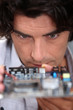 Man looking at a motherboard