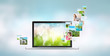 Open laptop at blue background. Pictures are flying out of the s