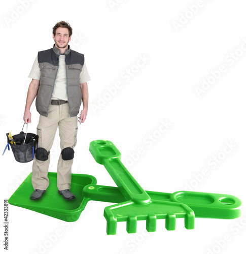 Photo: Man with spade and rake Man with spade and rake