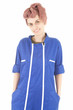 young woman worker in blue coveralls, white background