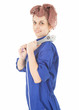 young woman worker in blue coveralls with tool