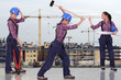 Female builder with construction site in background
