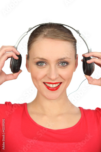 Photo: young woman listening music young woman listening music