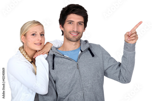 Photo: Smiling fair-haired woman and young man on white background Smiling fair-haired woman and young man on white background