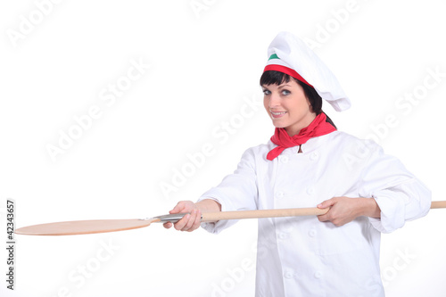 Photo: Female pizzeria chef Female pizzeria chef