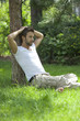 Foto: cool pensive man dreaming in a park cool pensive man dreaming in a park