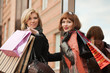 Two young women with shopping bags