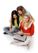 Photo: Three girls working with a laptop, sitting on the floor, Three girls working with a laptop, sitting on the floor,