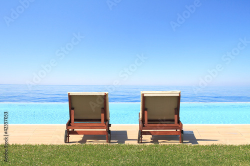 Photo: Luxury hotel swimming pool in front of the sea Luxury hotel swimming pool in front of the sea