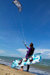 kitesurfer and his kite at sky background