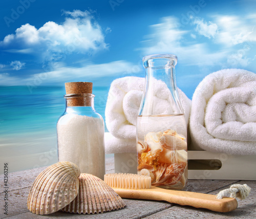 Photo: Towels with bath accessories at the beach Towels with bath accessories at the beach