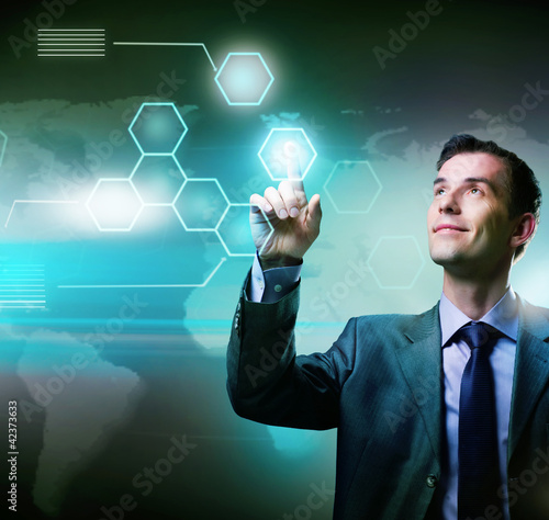 Illustration: Businessman pressing high tech buttons on a virtual touchscreen Businessman pressing high tech buttons on a virtual touchscreen