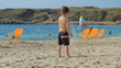 Video: Boy playing on the beach. Yoga Boy playing on the beach. Yoga