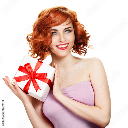 Photo: Young happy woman with a gift Young happy woman with a gift
