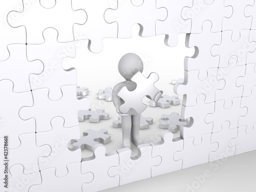 Illustration: Person holding puzzle piece about to complete vertical puzzle Person holding puzzle piece about to complete vertical puzzle