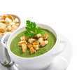 Cream soup with dried crusts isolated on white, studio shot