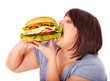 Woman eating hamburger.