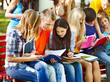 Group student with book outdoor.