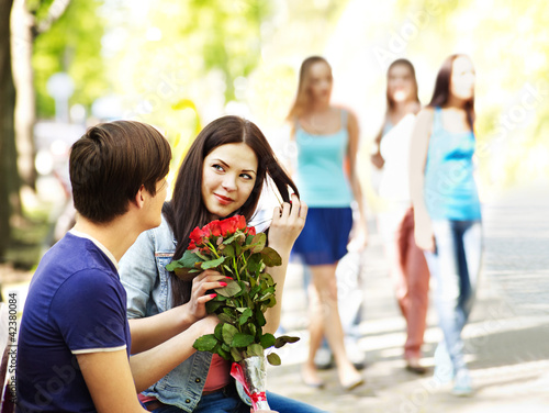 Photo: Couple of teenager on date outdoor. Couple of teenager on date outdoor.