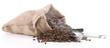 Fresh roasted smoking coffee beans in burlap sack