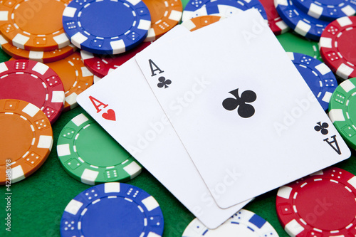 Photo: pocket aces on a casino table pocket aces on a casino table