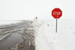 Photo: Crossroad in a stormy winter day with stop sign Crossroad in a stormy winter day with stop sign