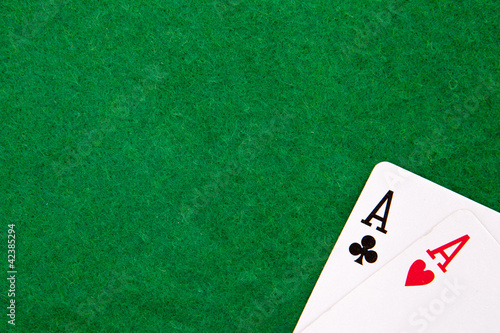 Photo: Texas holdem pocket aces on casino table with copy space Texas holdem pocket aces on casino table with copy space