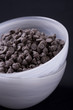 Vegan Chocolate Chips in White Bowl Vertical