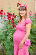 A pregnant woman (9 months) rests in a park