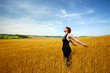 Foto: Female in wheat field enjoying summer Female in wheat field enjoying summer