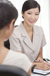 Asian Chinese Woman or Businesswoman in Office Meeting