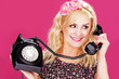 Woman talking on old telephone