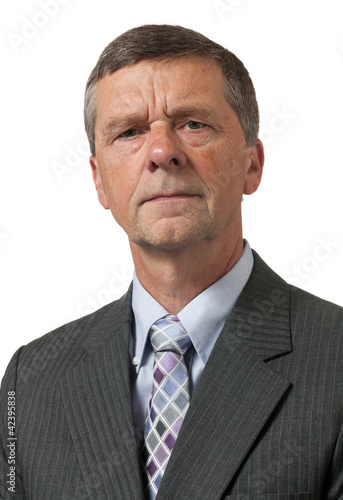 Photo: Senior man in blue shirt looks pensive Senior man in blue shirt looks pensive