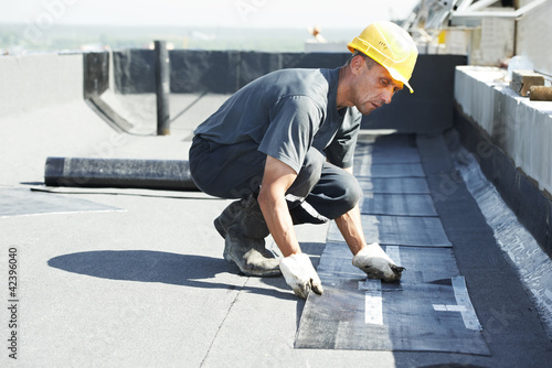 Photo: Flat roof covering works with roofing felt Flat roof covering works with roofing felt