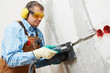 Electrician maching channel in wall
