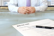 Job interview in the office with focus on resume and pen