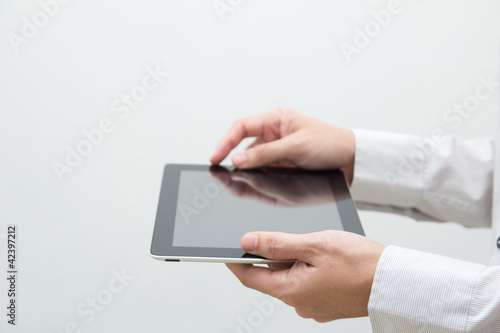 Photo: Business man hand tablet PC Business man hand tablet PC