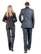 Photo: Back view of walking business team. Back view of walking business team.