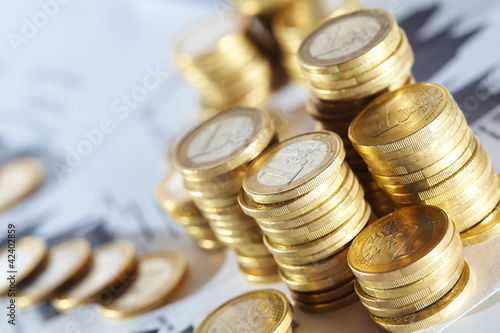 Photo: Business diagram on financial report with coins Business diagram on financial report with coins