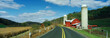 Photo: This is a country road with a farm on the right hand side of the road. It has a red barn and silo. This is a country road with a farm on the right hand side of the road. It has a red barn and silo.