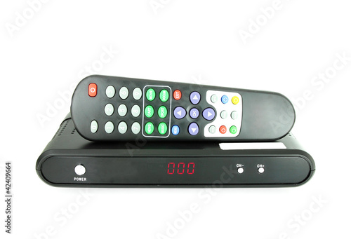 Photo: remote and receiver for satellite TV on white remote and receiver for satellite TV on white